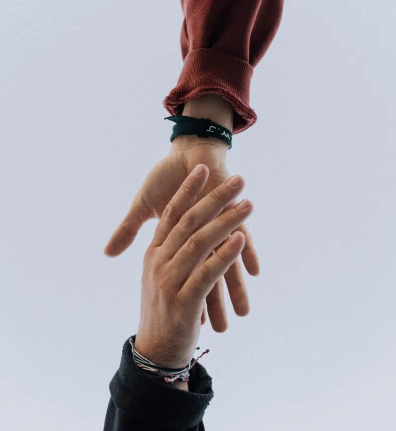 Hands Reaching Out To Each Other